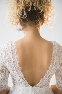 Back of Mixed Race woman wearing wedding dress
