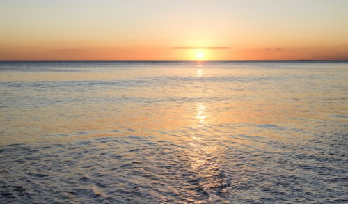 Sunset on ocean horizon