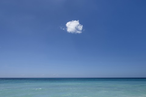 Cloud in blue sky over ocean