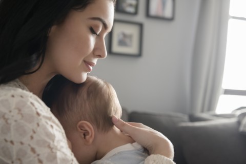 Caucasian mother comforting baby son