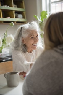 Older woman talking with daughter