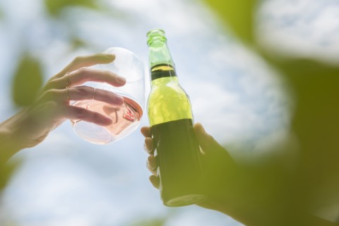 Women toasting with beer and wine