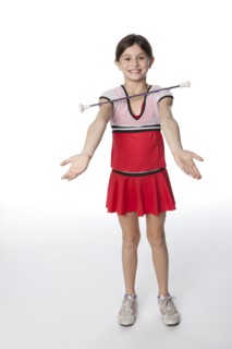 Caucasian girl twirling a baton