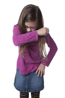Caucasian girl sneezing