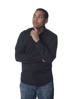 Serious man with hand on chin