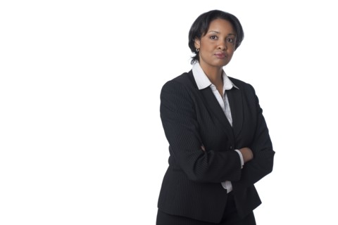 Serious mixed race businesswoman with arms crossed