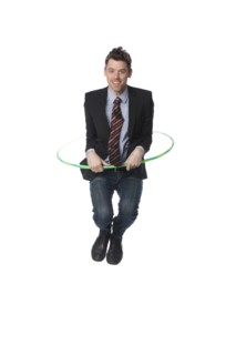 Caucasian businessman jumping plastic hoop