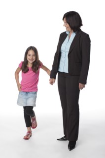Caucasian mother and daughter holding hands