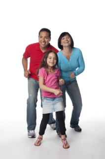 Smiling family dancing
