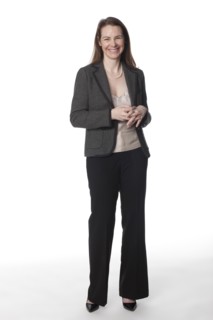 Caucasian businesswoman with hands clasped