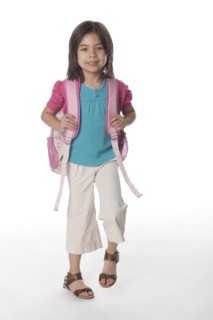 Mixed race girl carrying backpack