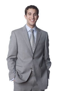 Caucasian businessman with hands in pockets