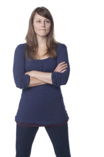 Serious Caucasian woman with arms crossed
