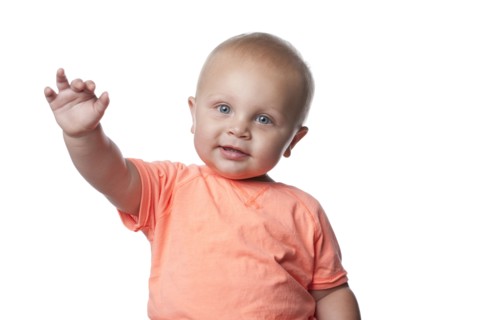 Smiling Caucasian baby boy with arms outstretched