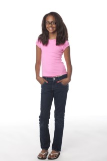 Smiling mixed race girl with hands in pockets