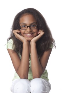 Smiling mixed race girl with head in hands