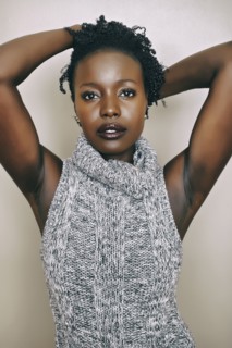 Black woman wearing knitted turtleneck