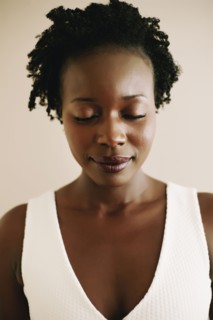 Black woman with eyes closed