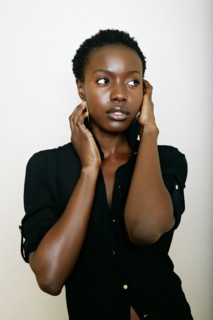 African American woman holding her face
