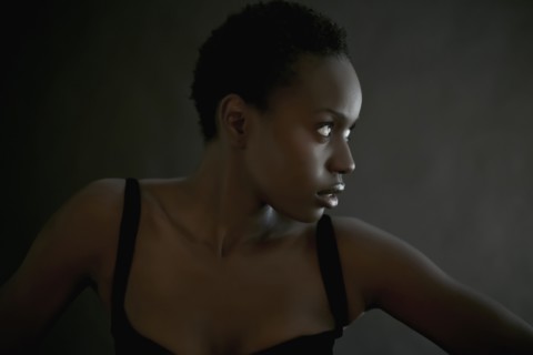 African American woman posing indoors