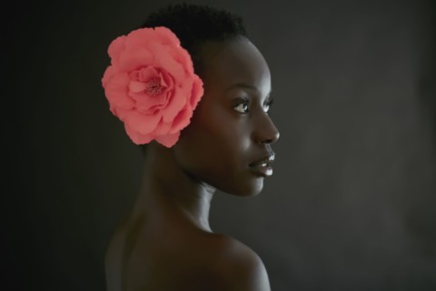 African American woman wearing flower in hair