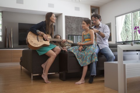 Family relaxing together in living room