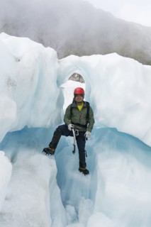 Portrait of Chinese man standing on glacier