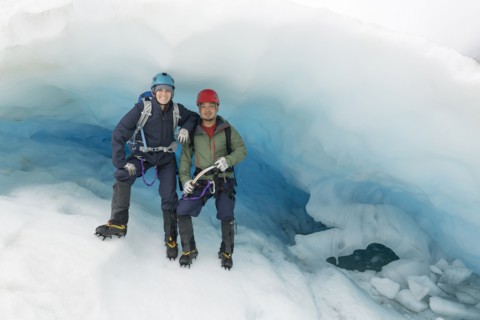 Portrait of couple standing on glacier
