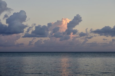 Clouds over ocean at sunrise