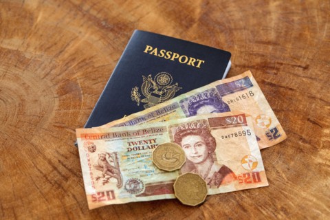 Passport and Belizian currency