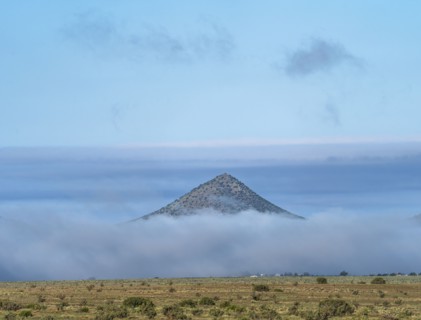 Clouds covering landscape in Cerrillos Hills State Park