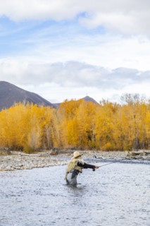 Senior woman fly-fishing