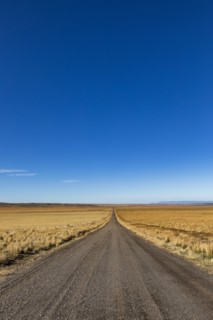 Empty desert road and blue sky