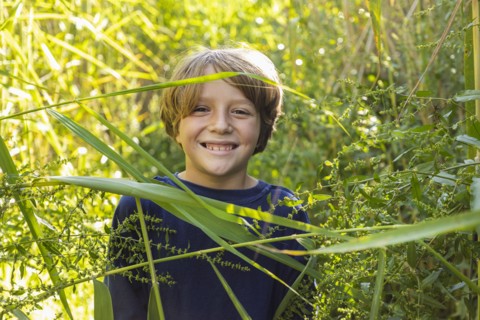 Outdoor portrait of happy boy