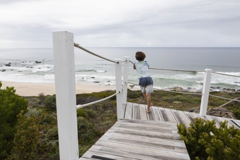Boy looking at ocean view