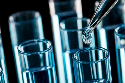 Pipette dropping liquid into test tube