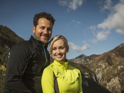 Portrait of smiling couple in mountain landscape
