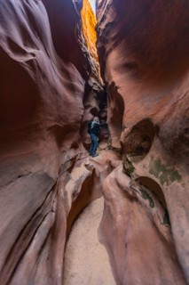 Senior hiker exploring slot canyon