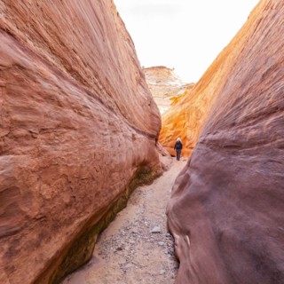 Senior hiker exploring slot canyon