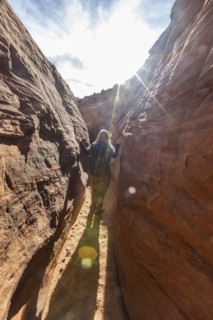 Senior hiker exploring slot canyon