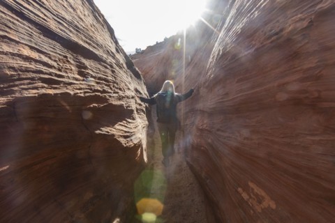 Senior hiker exploring slot canyon