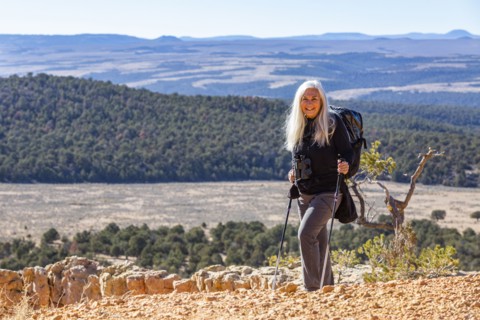Portrait of senior hiker in rocky landscape