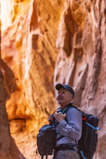 Senior hiker exploring rock formations in Kodachrome Basin State Park near Escalante Grand Staircase National Monument