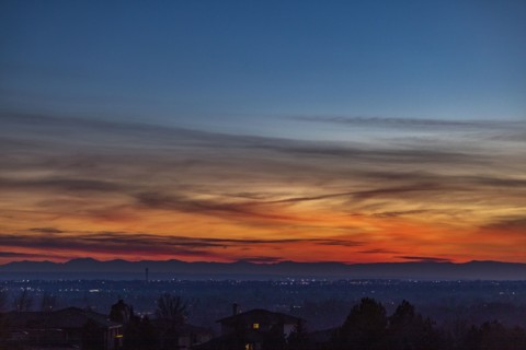Sunset above city and mountains