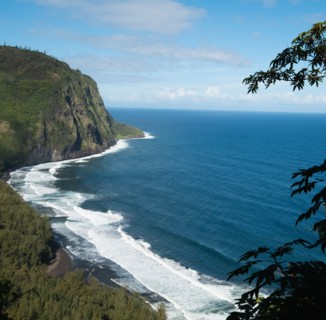 Black sand beach with cliffs