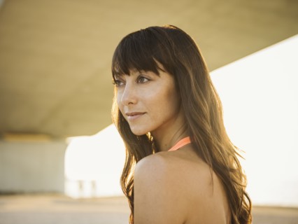 Portrait of pensive woman under bridge