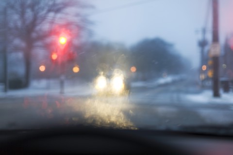 Street seen from car during snowstorm