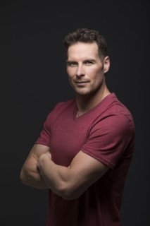 Studio portrait of serious man with arms crossed