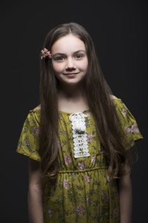 Studio portrait of smiling girl