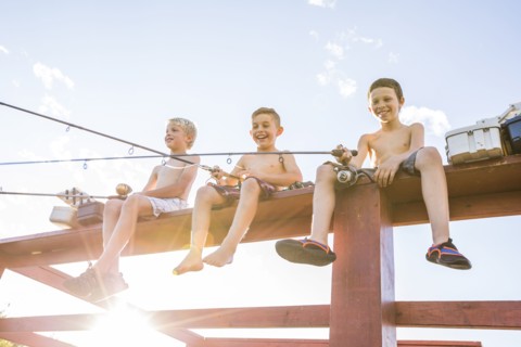 Low angle view of shirtless boys